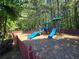 Fun community playground featuring slides, swings, and play structures for children at 4677 Liberty Square Dr, Acworth, GA 30101