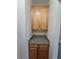 Stylish storage with granite countertop and light wood cabinets at 4677 Liberty Square Dr, Acworth, GA 30101
