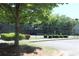 Community tennis court surrounded by trees and lush landscaping at 4677 Liberty Square Dr, Acworth, GA 30101