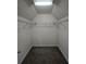 Walk-in closet features neutral walls, carpeted flooring, a light fixture, and wire rack shelving at 4677 Liberty Square Dr, Acworth, GA 30101