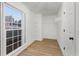 Walk-in closet with white walls, wire shelving, new vinyl floors, and natural light at 816 Ivy Ridge Dr, Loganville, GA 30052