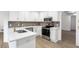 Bright, updated kitchen featuring stainless steel appliances and a clean, modern aesthetic at 816 Ivy Ridge Dr, Loganville, GA 30052