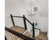 View from the top of stairs with lots of light, hardwood floors, and decorative chandelier at 816 Ivy Ridge Dr, Loganville, GA 30052
