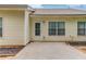 Back patio featuring a door and windows for indoor/outdoor living and entertaining at 965 Under Ct, Sugar Hill, GA 30518
