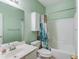 Bathroom featuring a vanity, toilet, and tub with a shower curtain at 965 Under Ct, Sugar Hill, GA 30518