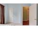 Bright bedroom featuring closet and doorway that leads into another room at 965 Under Ct, Sugar Hill, GA 30518