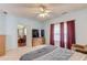 Spacious bedroom with natural lighting, a comfortable bed, and neutral décor at 965 Under Ct, Sugar Hill, GA 30518