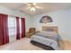 Inviting bedroom with a bed, accent chair, and ample natural light at 965 Under Ct, Sugar Hill, GA 30518