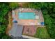 Aerial view of community pool and playground with lounge chairs and picnic tables at 965 Under Ct, Sugar Hill, GA 30518