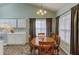 Charming dining area with a wooden table, chairs, and natural lighting at 965 Under Ct, Sugar Hill, GA 30518
