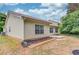 Charming home exterior with a well-maintained yard and patio, great for outdoor living at 965 Under Ct, Sugar Hill, GA 30518
