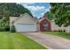 Charming single-Gathering home with a two-car garage and well-maintained front lawn at 965 Under Ct, Sugar Hill, GA 30518