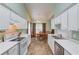 Open kitchen with appliances, a dining area, and plenty of natural light at 965 Under Ct, Sugar Hill, GA 30518