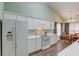 Bright kitchen with appliances and a connected dining area for easy serving at 965 Under Ct, Sugar Hill, GA 30518