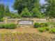 Stone community sign for Country Club of Roswell Willow Springs surrounded by lush landscaping at 10320 Crescent Ridge Dr, Roswell, GA 30076