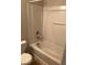 Clean white bathroom with a standard tub and shower combination at 1843 Grove Way, Hampton, GA 30228