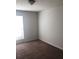 Neutral bedroom with carpeted floors and a large window for natural light at 1843 Grove Way, Hampton, GA 30228