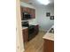 Kitchen features stainless steel appliances, light countertops, and hardwood floors at 1843 Grove Way, Hampton, GA 30228