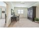 Bright bedroom features a desk, armoire, and neutral carpet at 2313 Saint Davids Nw Sq # 12, Kennesaw, GA 30152