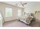 Inviting bedroom with patterned bedding, natural light, and ceiling fan at 2313 Saint Davids Nw Sq # 12, Kennesaw, GA 30152