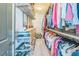 Walk-in closet with shelves, drawers and storage for an organized wardrobe at 2313 Saint Davids Nw Sq # 12, Kennesaw, GA 30152