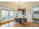 Bright dining area with natural light and hardwood floors leading to an outdoor patio at 2313 Saint Davids Nw Sq # 12, Kennesaw, GA 30152