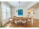 Elegant dining room with hardwood floors, modern lighting, and large windows, perfect for Gathering gatherings at 2313 Saint Davids Nw Sq # 12, Kennesaw, GA 30152