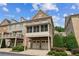 Charming townhome showcases a brick exterior, two-car garage, and a screened-in porch for outdoor enjoyment at 2313 Saint Davids Nw Sq # 12, Kennesaw, GA 30152