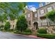 Charming brick townhome with manicured landscaping, stone accents, and inviting curb appeal at 2313 Saint Davids Nw Sq # 12, Kennesaw, GA 30152