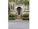 Elegant front entrance featuring stone steps, decorative shrubs, and classic architectural details at 2313 Saint Davids Nw Sq # 12, Kennesaw, GA 30152