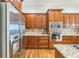 Kitchen with stainless steel appliances, granite countertops, and hardwood floors at 2313 Saint Davids Nw Sq # 12, Kennesaw, GA 30152