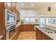 Kitchen with stainless steel appliances, granite countertops, and hardwood floors at 2313 Saint Davids Nw Sq # 12, Kennesaw, GA 30152