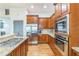 Kitchen with stainless steel appliances, granite countertops, and hardwood floors at 2313 Saint Davids Nw Sq # 12, Kennesaw, GA 30152