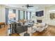 Inviting living room featuring hardwood floors, stylish furnishings, a fireplace, and large windows at 2313 Saint Davids Nw Sq # 12, Kennesaw, GA 30152