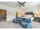 Spacious bedroom with ceiling fan, sitting area and access to a walk-in closet at 2313 Saint Davids Nw Sq # 12, Kennesaw, GA 30152