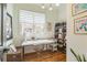 Bright office space with a large window, desk, and storage shelves at 2313 Saint Davids Nw Sq # 12, Kennesaw, GA 30152