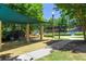 Community playground includes swings, slides, and climbing structures, offering a fun space for  at 2313 Saint Davids Nw Sq # 12, Kennesaw, GA 30152