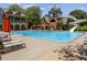 Community pool with waterslide and lounge chairs offers a perfect spot for relaxation and recreation at 2313 Saint Davids Nw Sq # 12, Kennesaw, GA 30152