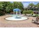 Splash pool features a fun water fountain and a seating area for relaxation near the main clubhouse at 2313 Saint Davids Nw Sq # 12, Kennesaw, GA 30152