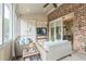 Inviting screened porch with comfortable seating and brick accents at 2313 Saint Davids Nw Sq # 12, Kennesaw, GA 30152