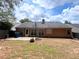 The backyard has a patio and basketball hoop with view of house at 3625 Ennfield Ln, Duluth, GA 30096