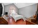 Bedroom features vaulted ceiling, a window, a bed, and a pet stair at 3625 Ennfield Ln, Duluth, GA 30096