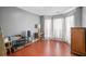 Bonus Room featuring wood floors, many windows, and neutral color palette at 3625 Ennfield Ln, Duluth, GA 30096