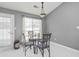 Cozy breakfast nook featuring a glass table and seating for four near a bright window at 3625 Ennfield Ln, Duluth, GA 30096