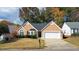 Charming one-story home with a two car garage, well-maintained lawn, and manicured shrubbery at 3625 Ennfield Ln, Duluth, GA 30096
