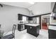 Modern kitchen featuring stainless steel appliances, an island, and white tile floors at 3625 Ennfield Ln, Duluth, GA 30096