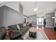 Spacious living room with high ceilings, hardwood floors, fireplace, and ample seating at 3625 Ennfield Ln, Duluth, GA 30096