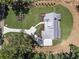 Birds eye view of the luxurious property featuring a sprawling lawn and elegant driveway at 779 Hicks Rd, Canton, GA 30115