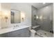 Elegant bathroom with glass shower, marble countertop, and modern fixtures at 779 Hicks Rd, Canton, GA 30115
