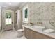 Charming bathroom features floral wallpaper, stylish fixtures, and ample natural light at 779 Hicks Rd, Canton, GA 30115